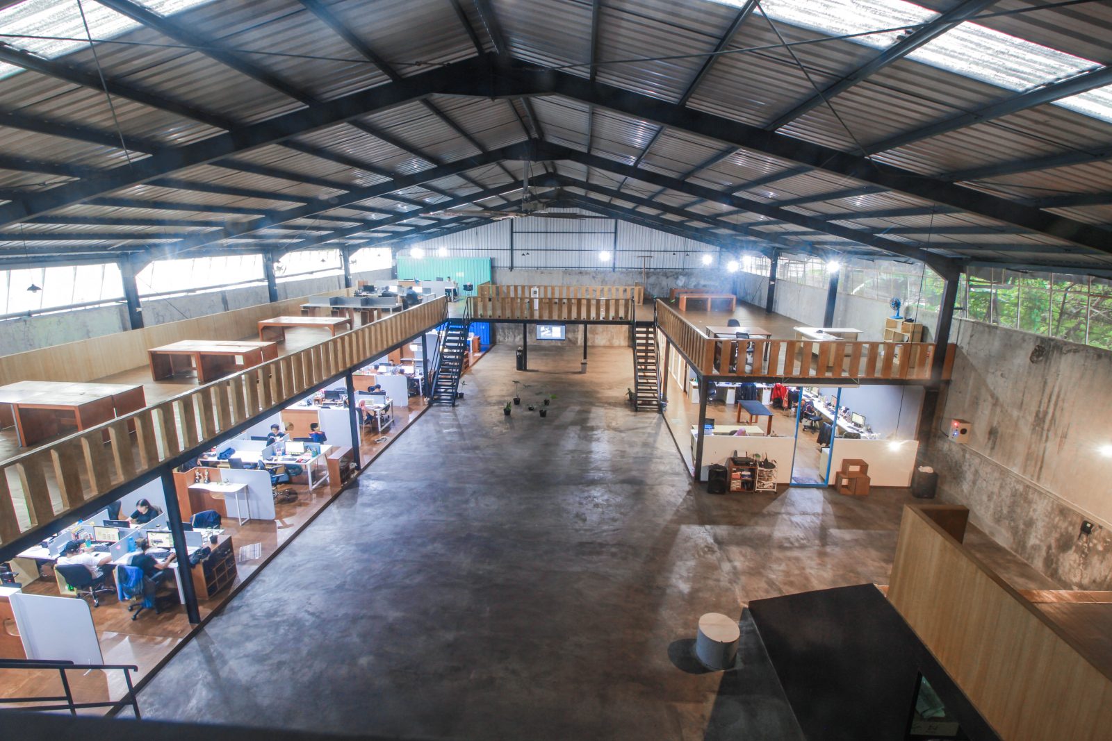 The massive office space is a renovated warehouse in Malang, Indonesia.