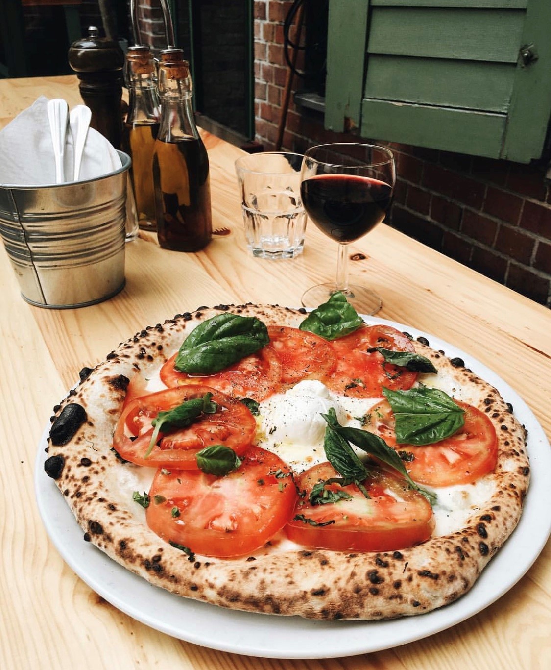 Zola makes authentic Neapolitan pizza in a fire oven. (Photo via Zola's instagram)