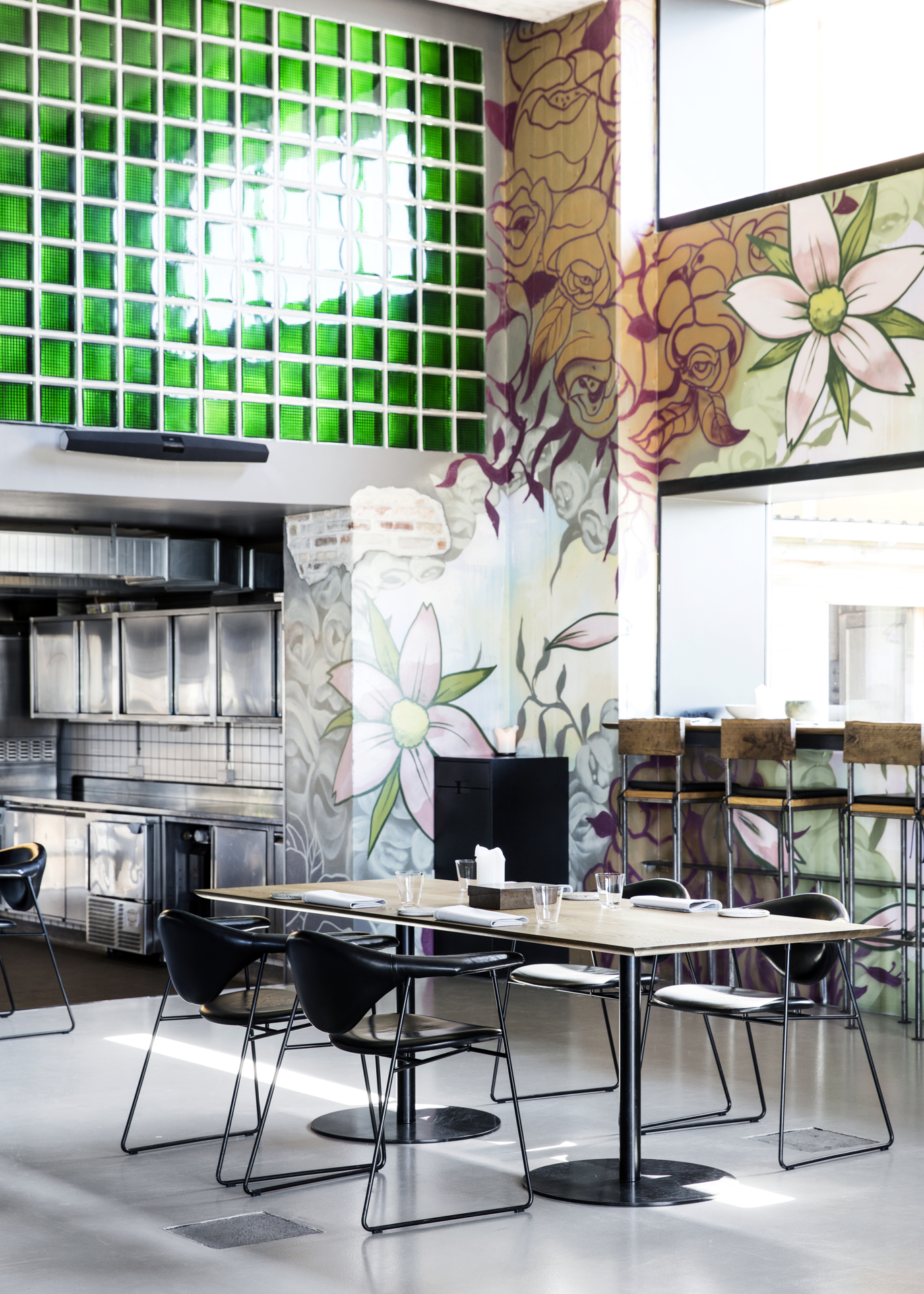 Picture of a dining area with a green wall