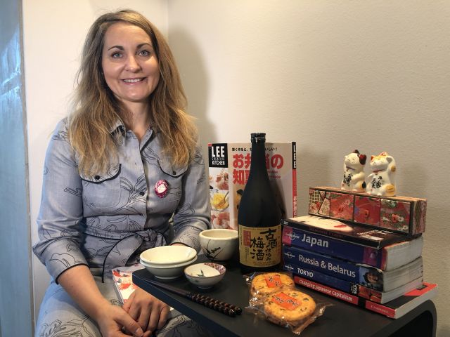 Woman sitting with Japanese things