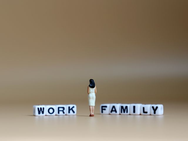 Woman between work and family