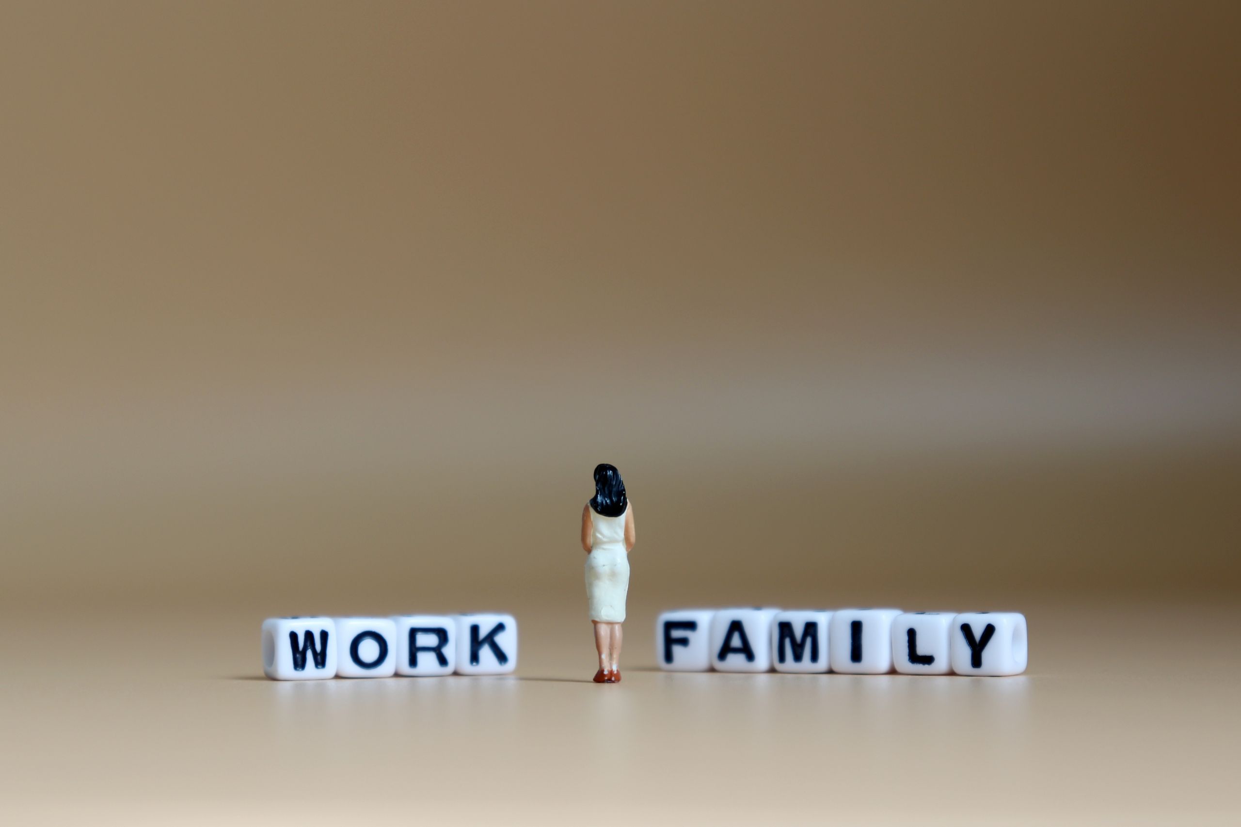 Woman between work and family