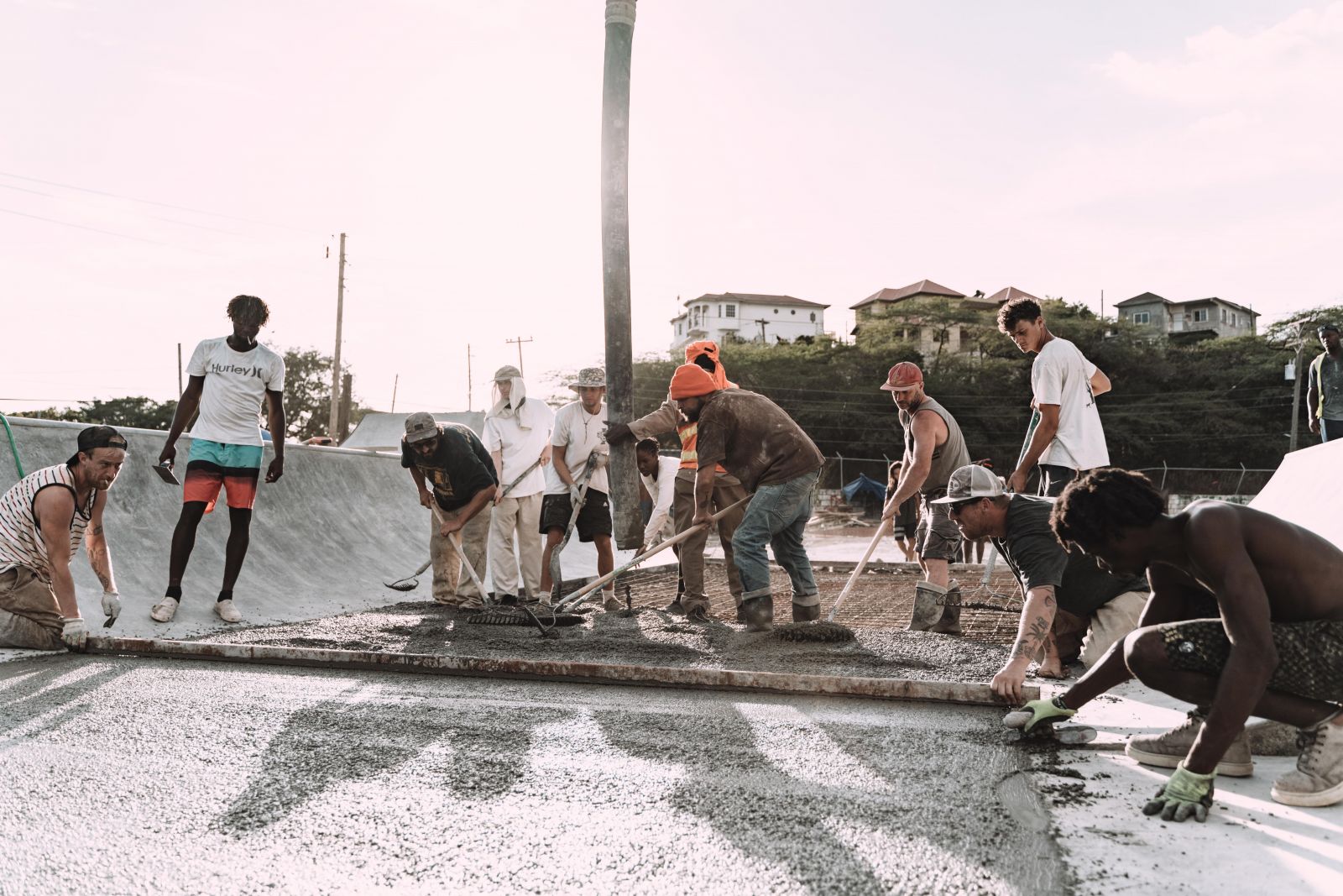 group of young people working on skateboard park