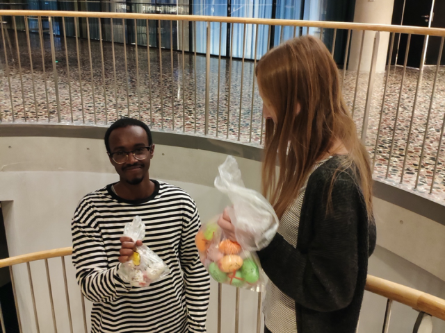 two people collecting easter eggs