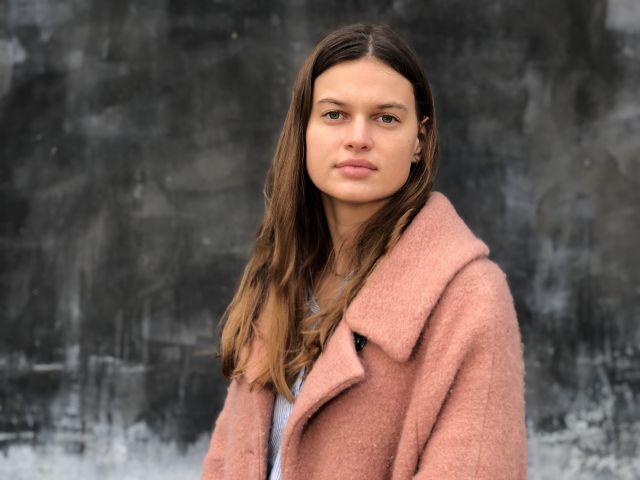 Female student in pink coat