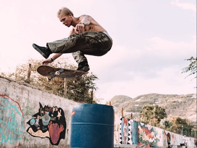 young man flying on skateboard