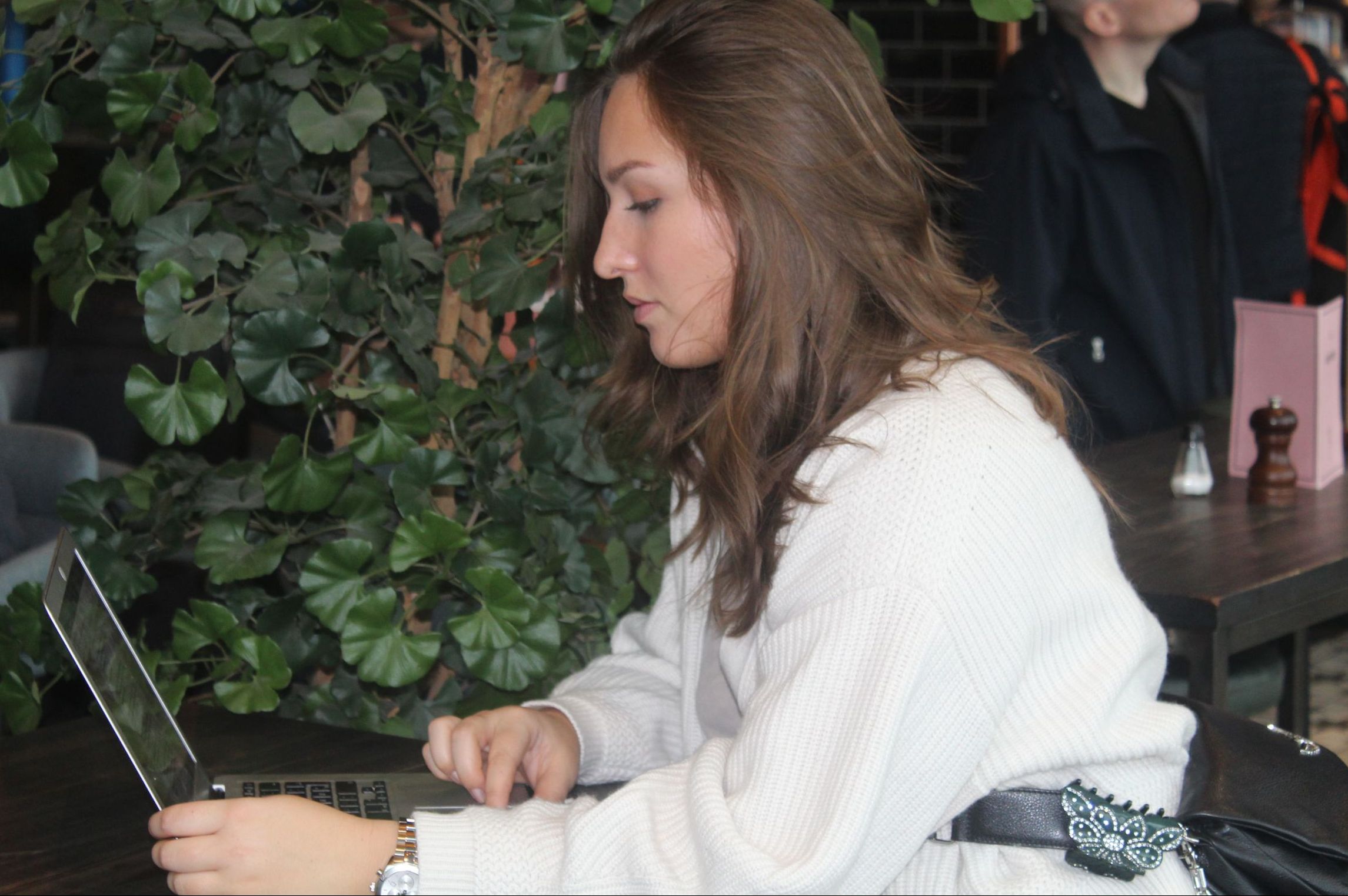 young woman working by computer