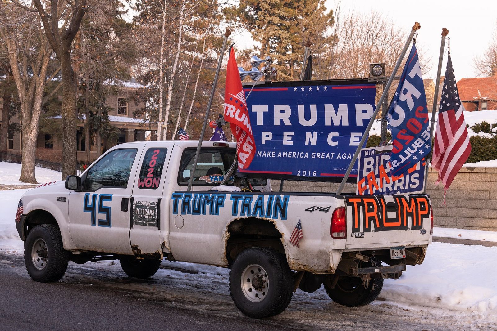 Pick-up truck decorated with Trump banners