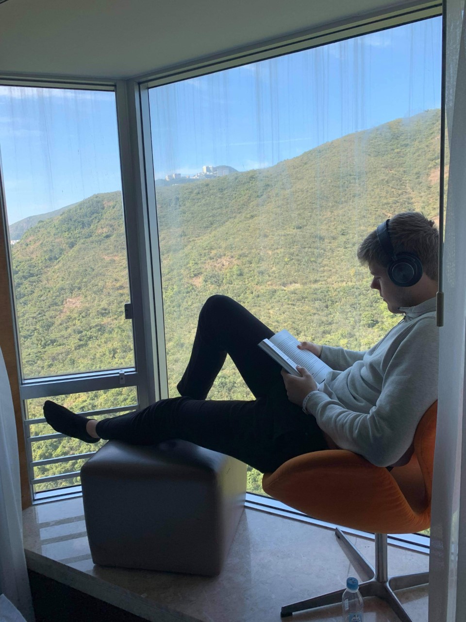 Student sitting in window sill