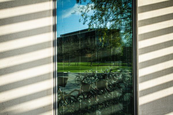 University reflected in window