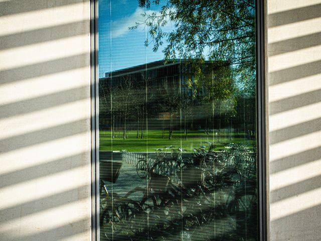 University reflected in window
