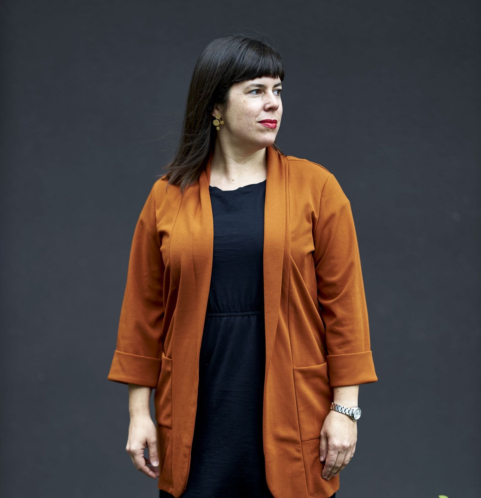 Woman in orange cardigan