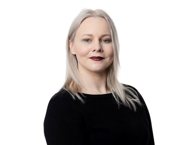 Woman in black shirt and dark lipstick