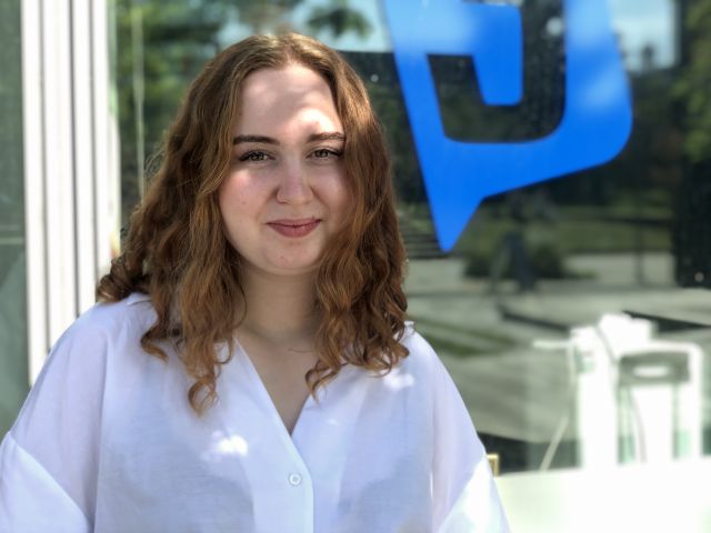 Girl with red hair and a white shirt