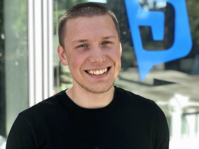 Smiling guy in black shirt