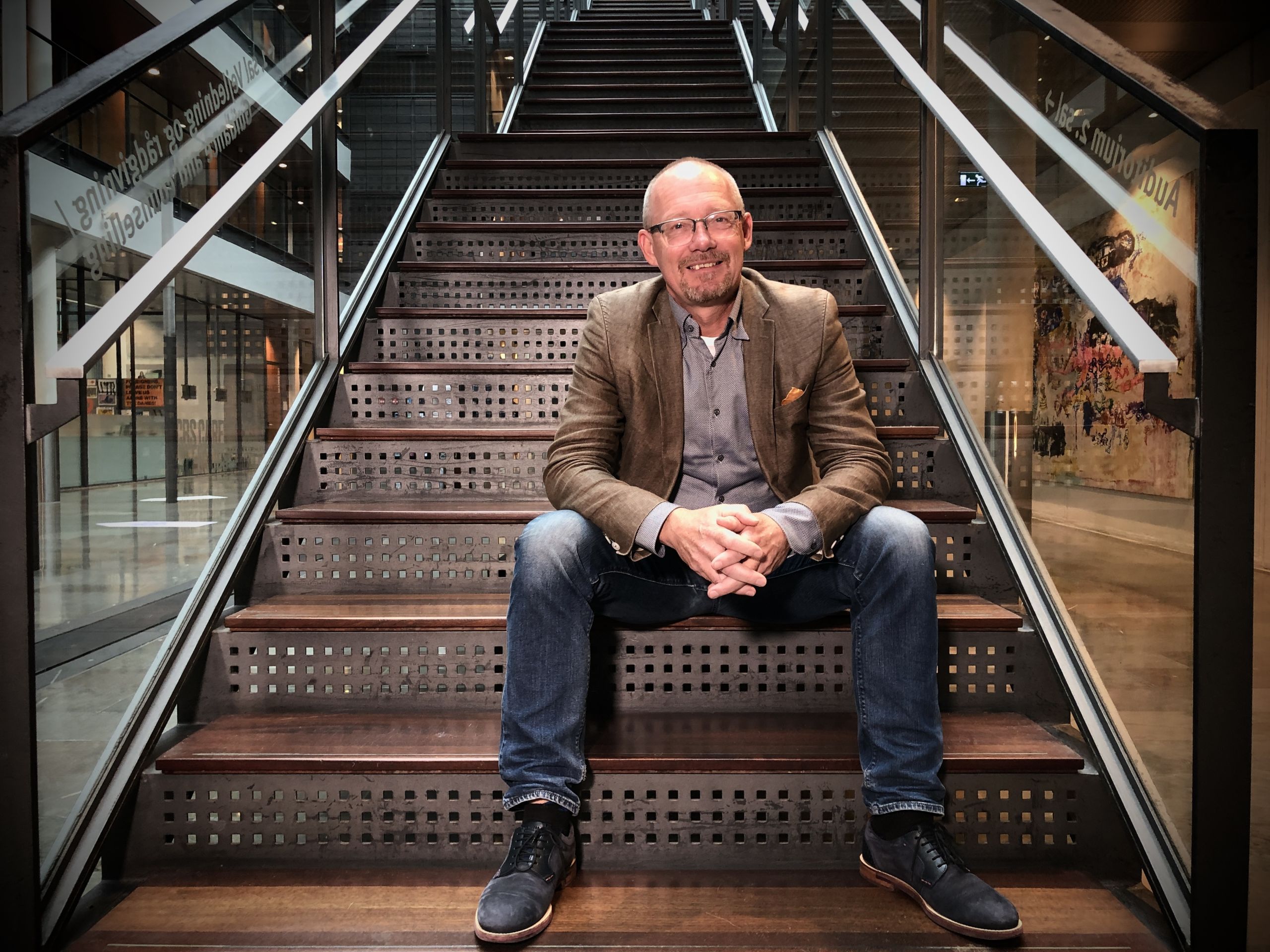 man sitting on staircase