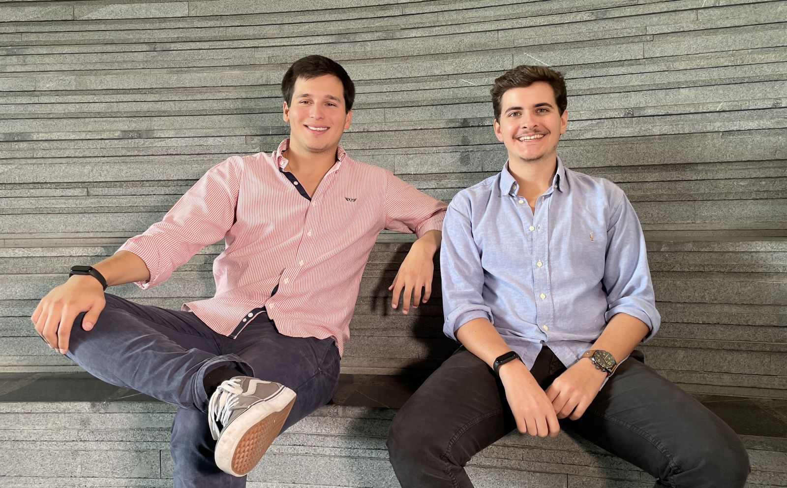 Two guys sitting on stairs