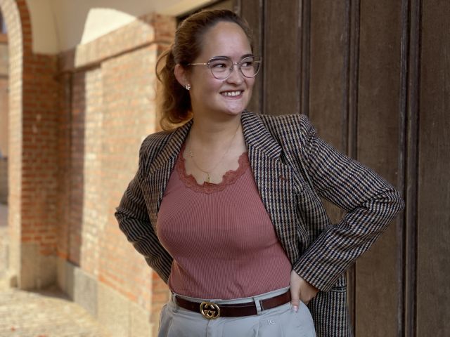 Woman in brown blazer