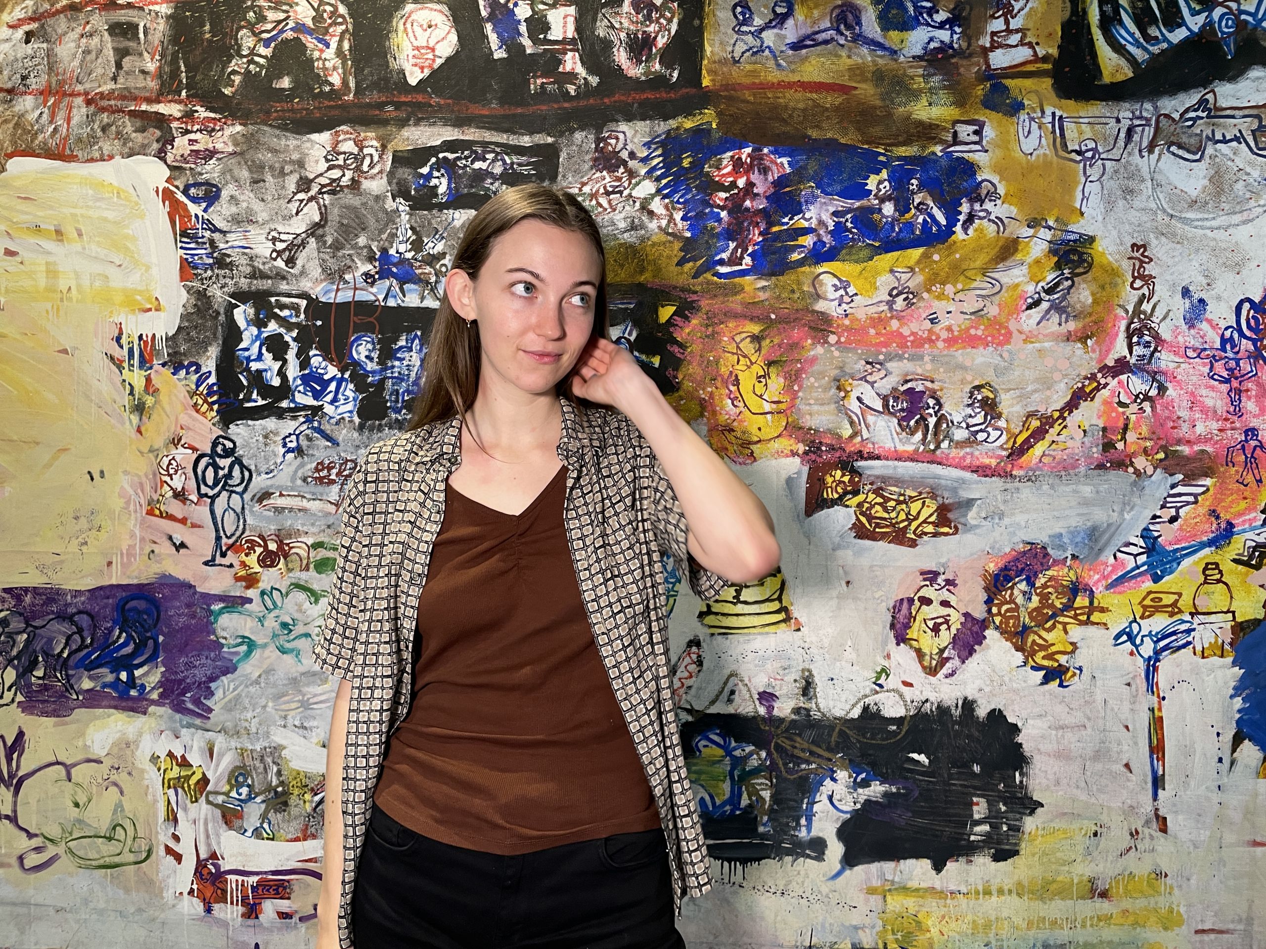 Woman in brown t-shirt and checkered shirt