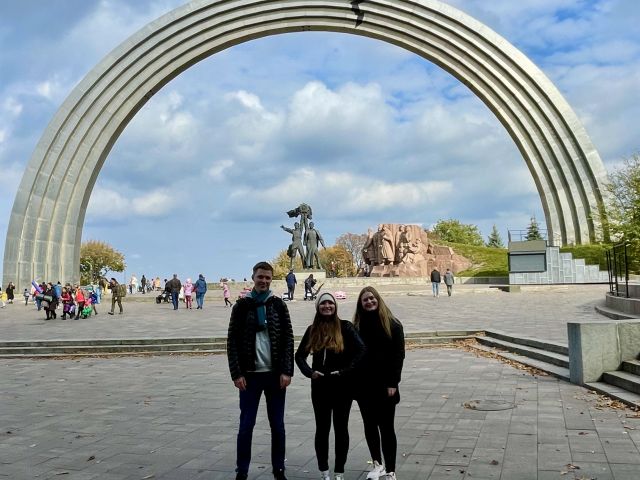 Posing in front of the Friendship Arch in Kyiv, Ukraine.